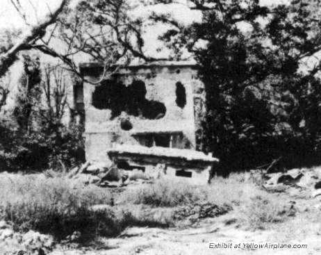 Cannon fire created these holes in this building on Ie Shima in WW2