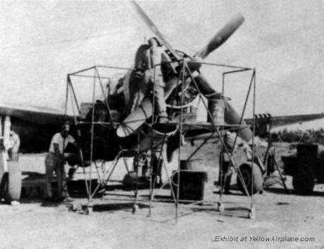 A P47 Thunderbolt WWII Prop Fighter sits on Wing Stands on the island of Ie Shima