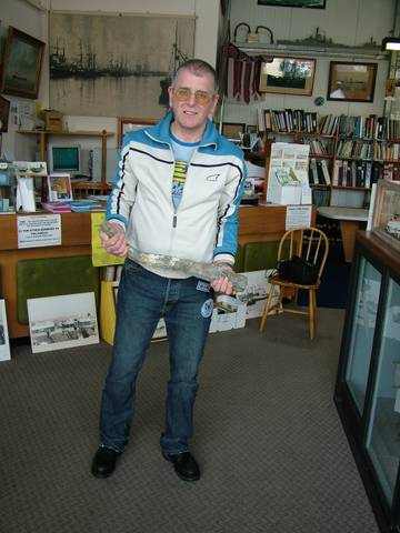 Brian Barnes holding the sounding weight from the HMS Brazen Sloop