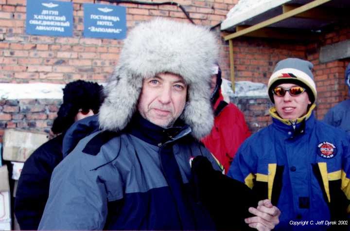 Jeff Dyrek and Andrew in front of the Khatanga Hotel with an Arctic Wolf Hat