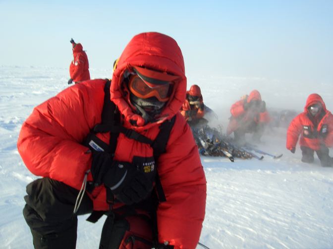 Ski Expedition members brace for the helicopter rotor blades