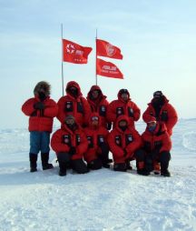 The Chinese Ski Team standing on the North Pole Polar Ice Cap