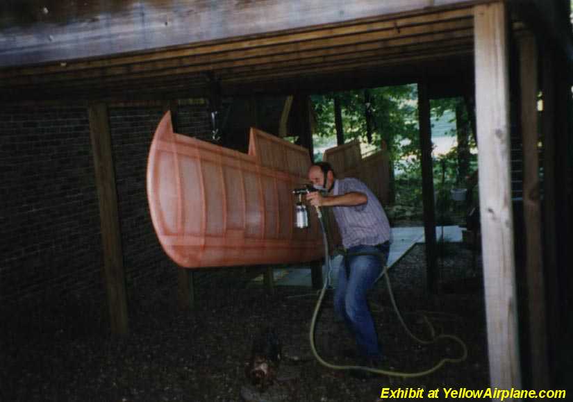 A Picture of Chuck Putting the first coats of paint on his Pitts aircraft upper wing.