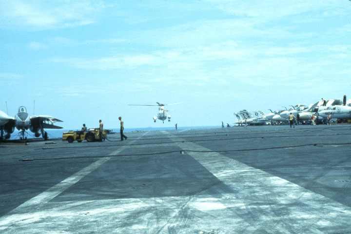 you can see the arresting cables on this aircraft carrier as the H-3 Sea King Lands