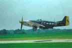 a p-51 mustang, the gunfighter, takes off at the quad cities airshow