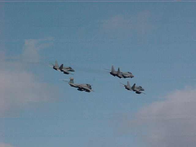 heres one f14 tomcat, 2  f18 hornets and one ea-6b prowler in formation