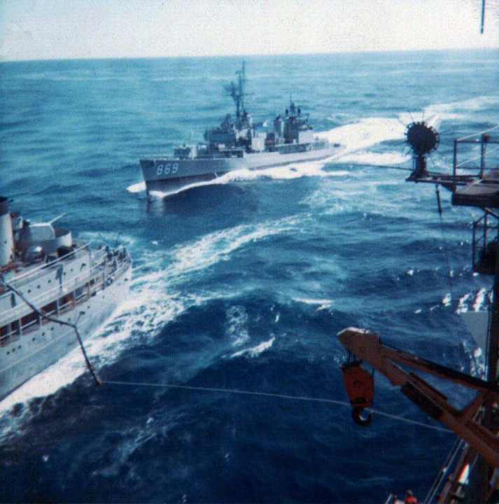 the Navy destroyer, DD-968 comes along side the USS Sacramento and the  USS Kitty Hawk.