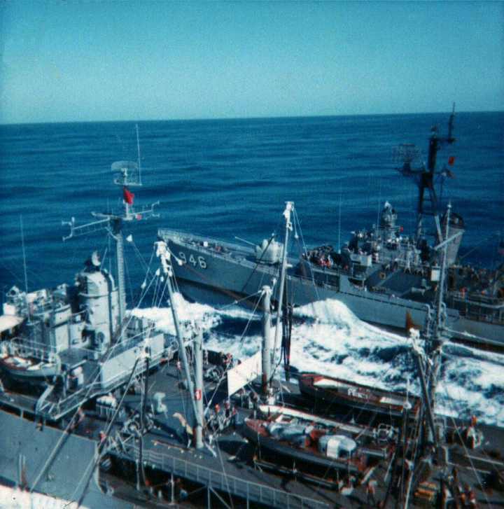 The USS Sacramento Tanker  refuels from the USS Kitty Hawk Aircraft Carrier.